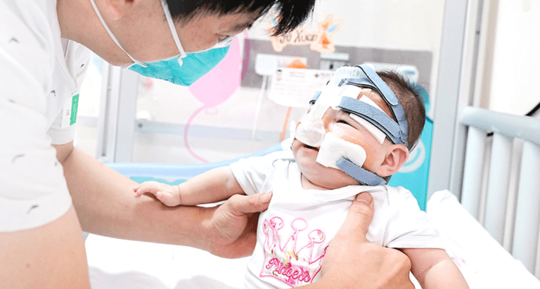 Smallest baby at birth goes home after over a year in hospital