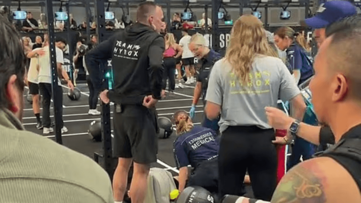 Hyrox athlete completes race while girlfriend is treated by paramedics
