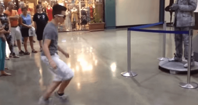 WATCH: Boy-vs-Human Statue Have An Incredible Dubstep Dance-Off. We Want These Moves!